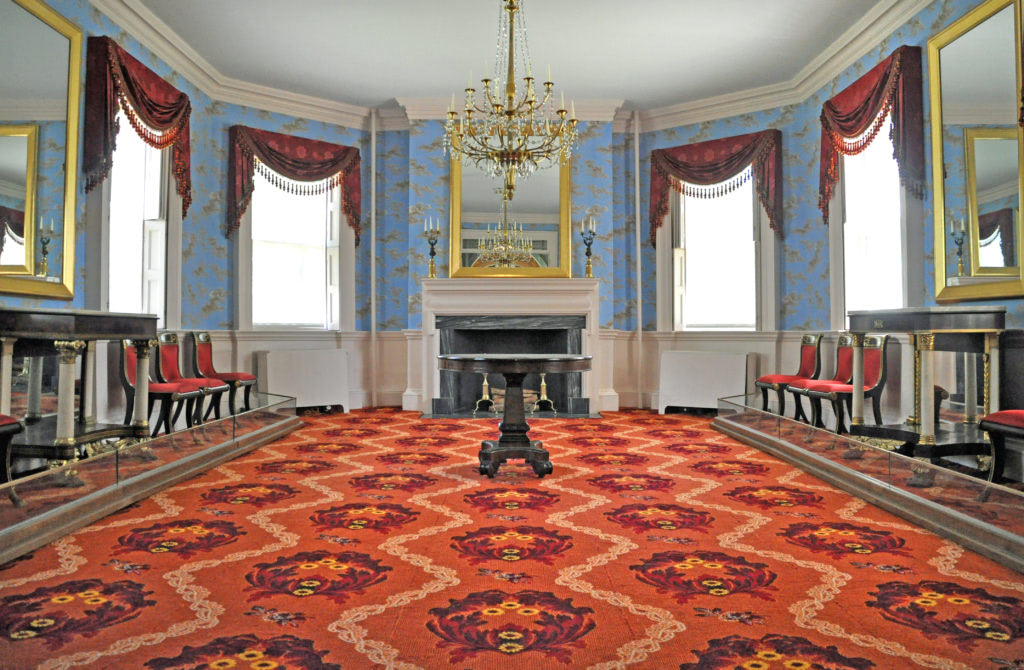 Blue room with a red carpet inside the Morris-Jumel Mansion Museum