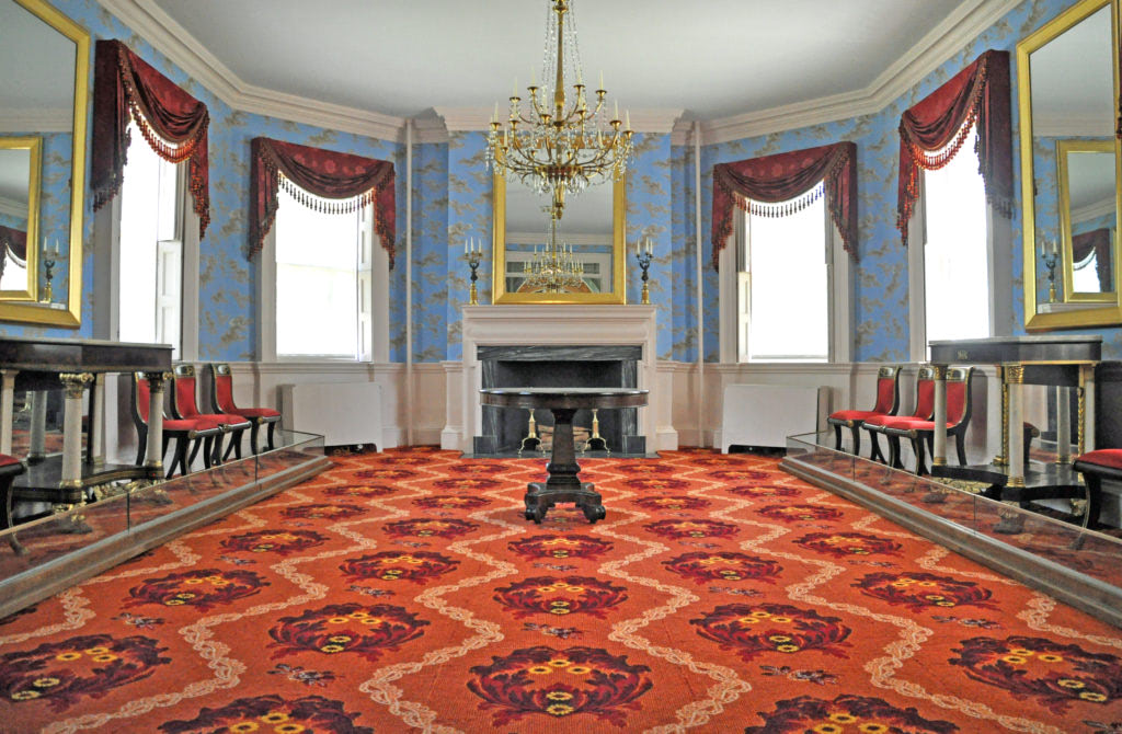Blue room with a red carpet inside the Morris-Jumel Mansion Museum