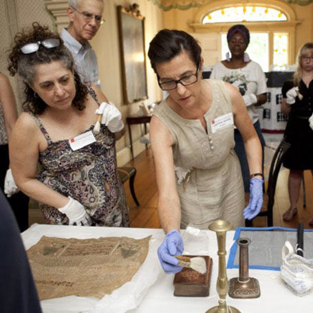 Curators working on preserving historical artifacts