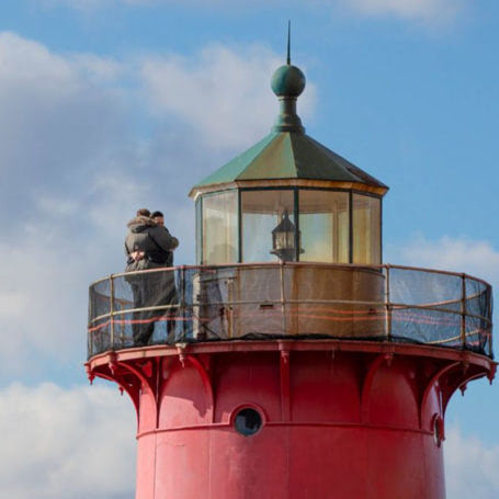 Visitors standing at the top of the Little Red Lighthouse