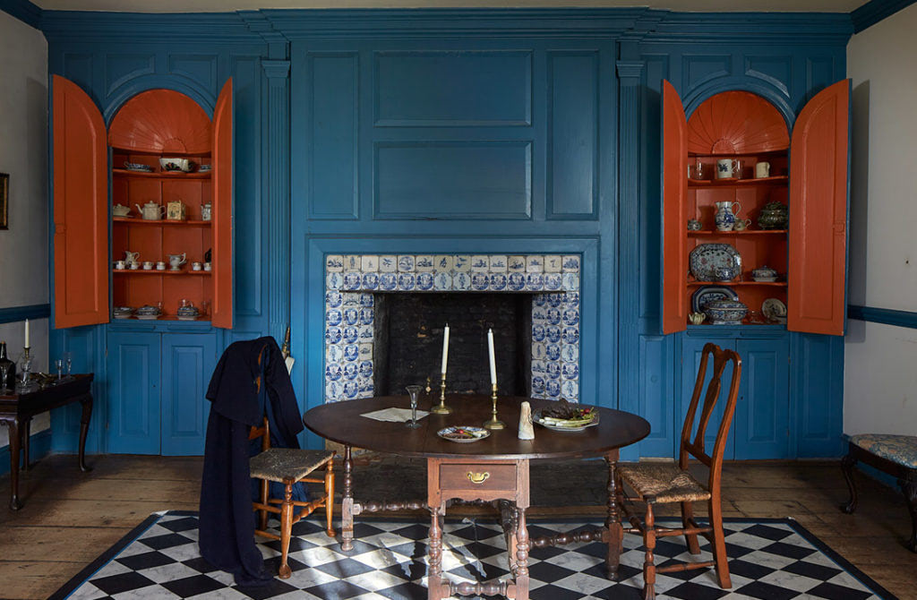 Table setting ina. blue walled room inside the Van Cortlandt House Museum